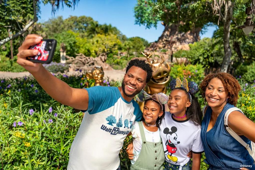 The Lion King Golden Statues A family taking a selfie in front of the Lion King golden statues and the Tree of Life