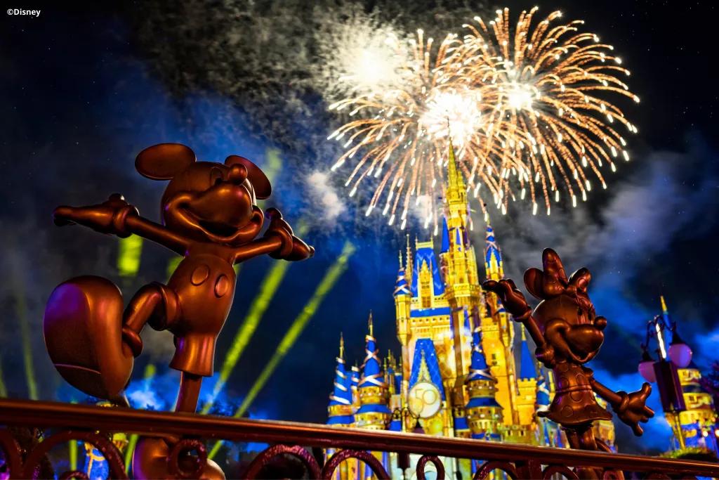 Mickey and Minnie Golden Statues Golden statues of Mickey and Minnie in front of Cinderella Castle during the fireworks