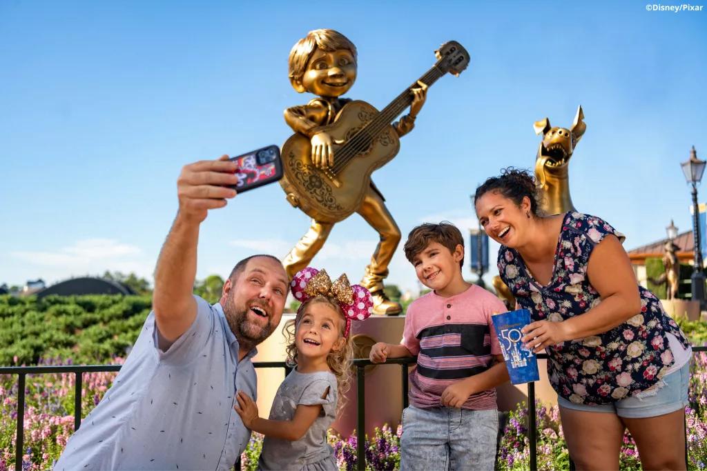 Miguel and Dante Golden Statues A family taking a selfie in front of the Miguel and Dante statues in EPCOT