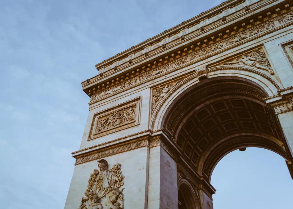 Arc de Triomphe Looking up at the Arc de Triomphe in front of a blue sky