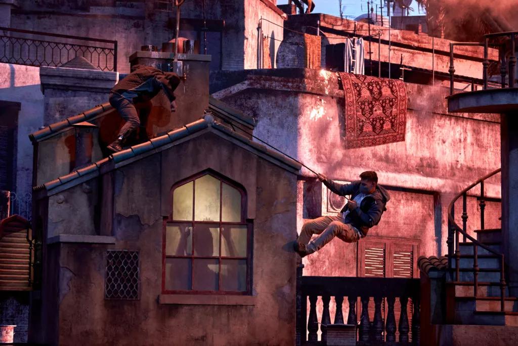 The Bourne Stuntacular Stunt actors climbing down from a rooftop in the Bourne Stuntacular