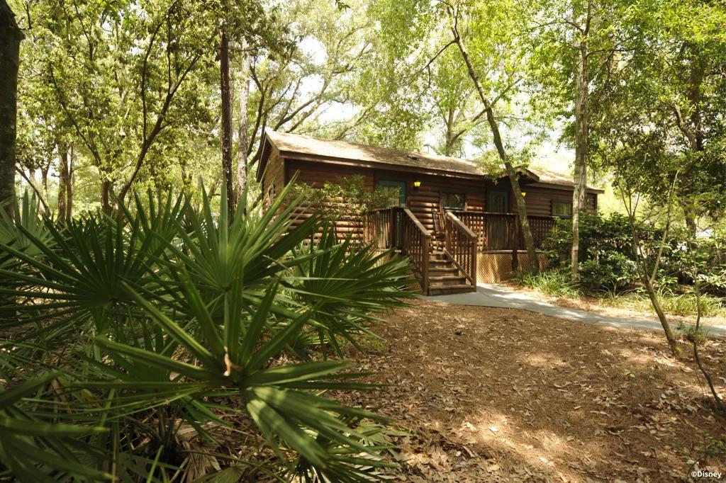 Disney's Fort Wilderness Resort A log cabin surrounded by trees at Disney's Fort Wilderness Resort