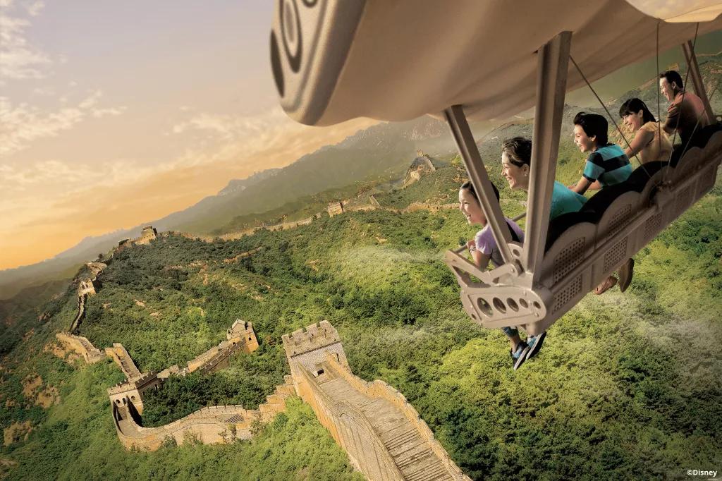 Soarin' Around the World People in a ride vehicle flying over a simulation of the Great Wall of China
