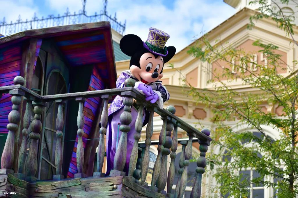 Mickey's Halloween Celebration Cavalcade Mickey Mouse dressed in a distressed top hat and tails on a Halloween float