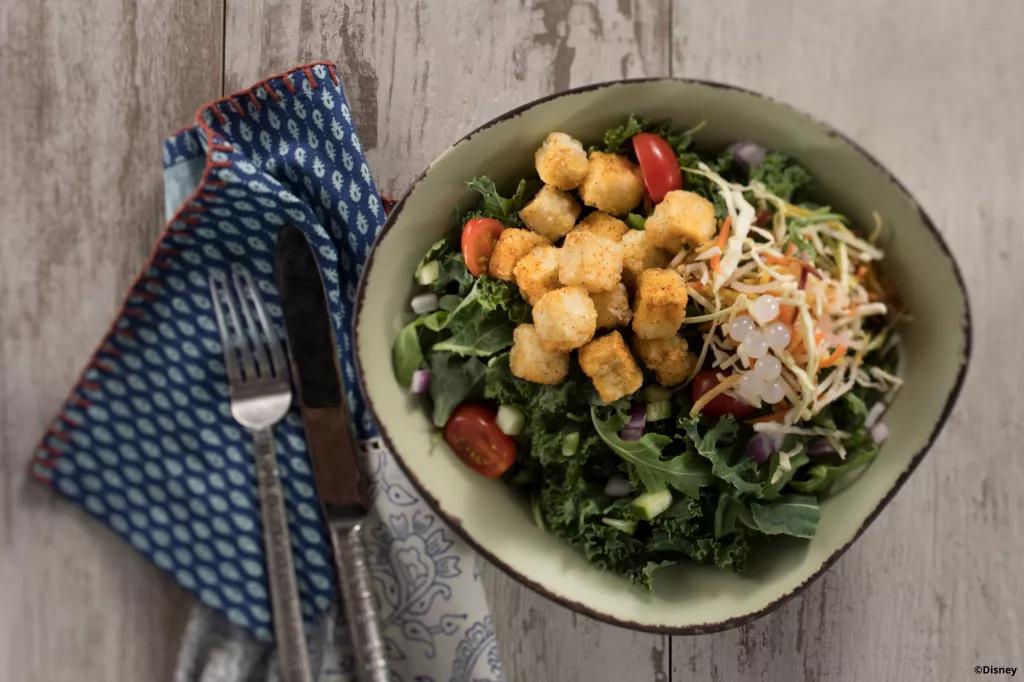 Tofu Protein Bowl from Satu'li Canteen Bird's eye view of a tofu salad bowl on a wooden table