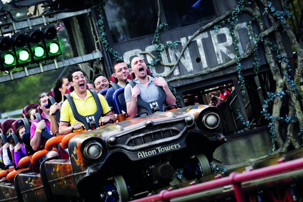 Rita Guests screaming while riding a roller coaster