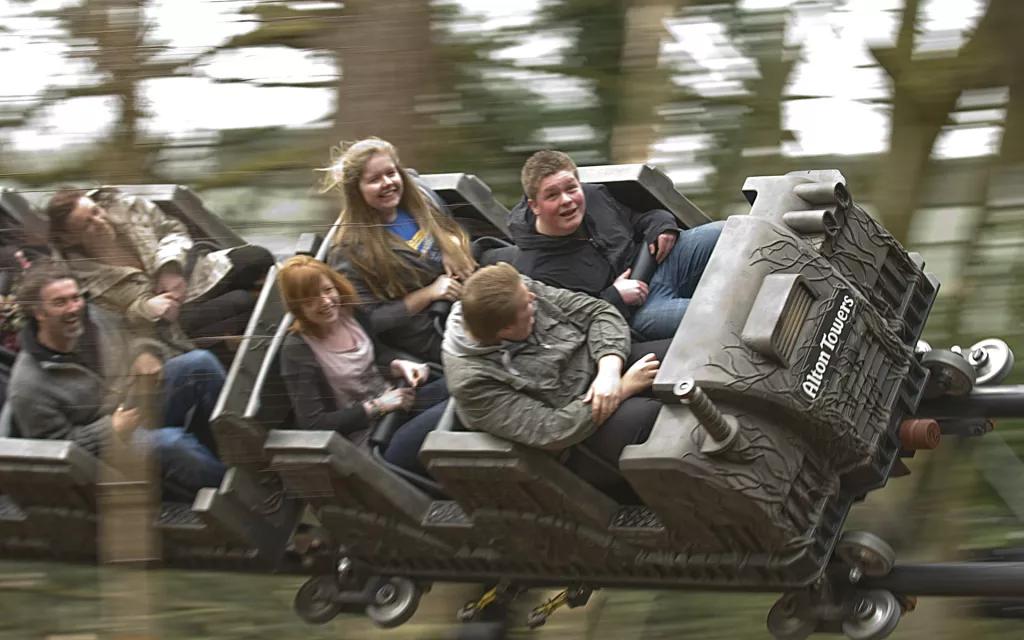 Th13teen Teenagers riding a roller coaster