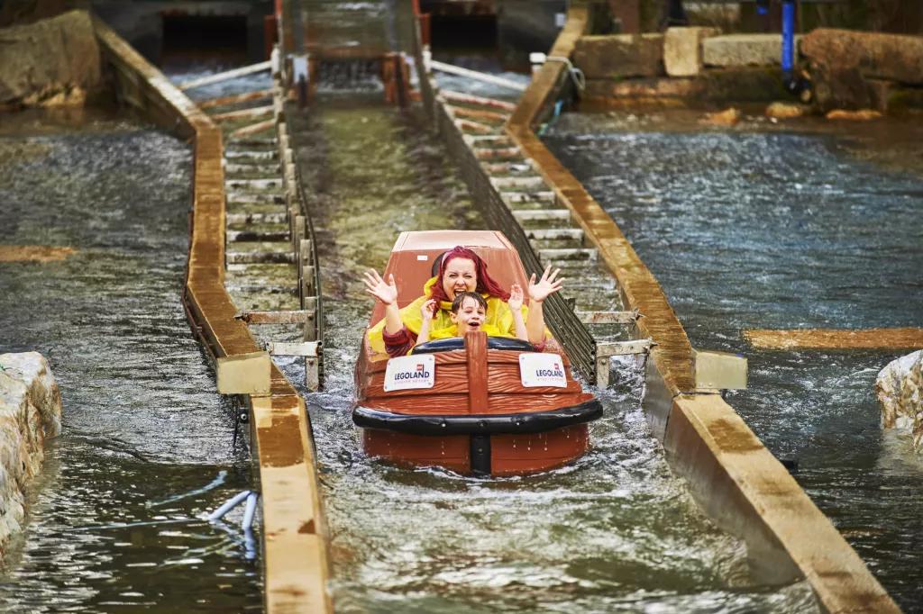 Pirate Falls: Treasure Quest A woman and child soaking wet after dropping down on a log flume