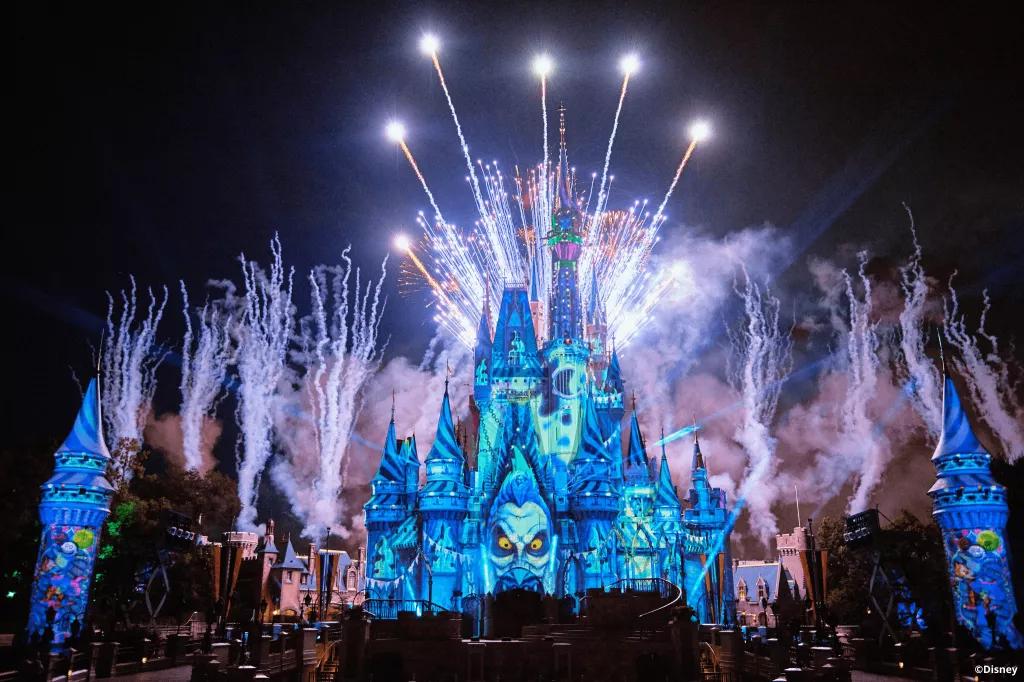 Halloween Fireworks Cinderella Castle projected with Disney Villains with fireworks in the background