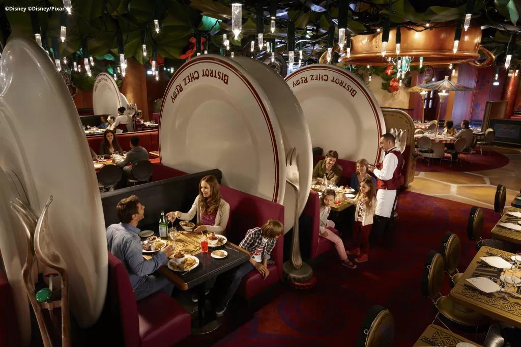 Bistrot Chez Remy Guests eating in Bistrot Chez Remy sat on benches that look like giant plates