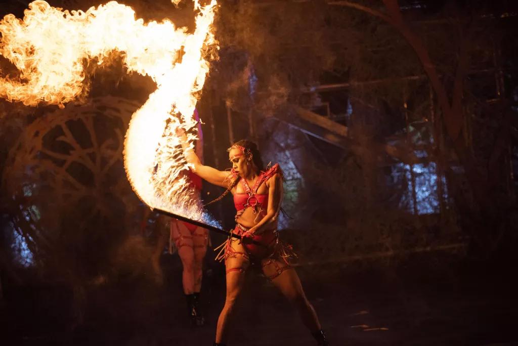 Halloween Nightmare Fuel Wildfire A female performer dancing with a sword that is on fire