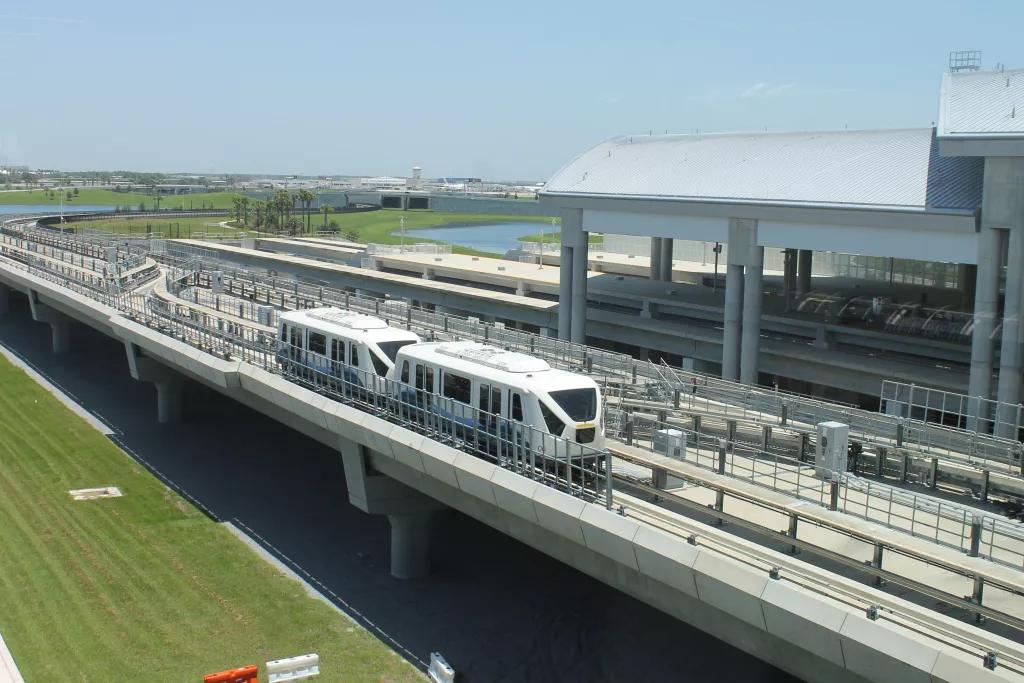 Automated trams at Orlando International Airport An automated tram taking passengers between terminals at Orlando International Airport