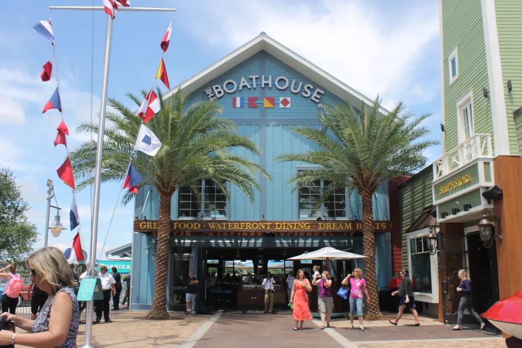 The Boathouse - Disney Springs The entrance to Boathouse restaurant clad with blue panels and decorated with sailing flags