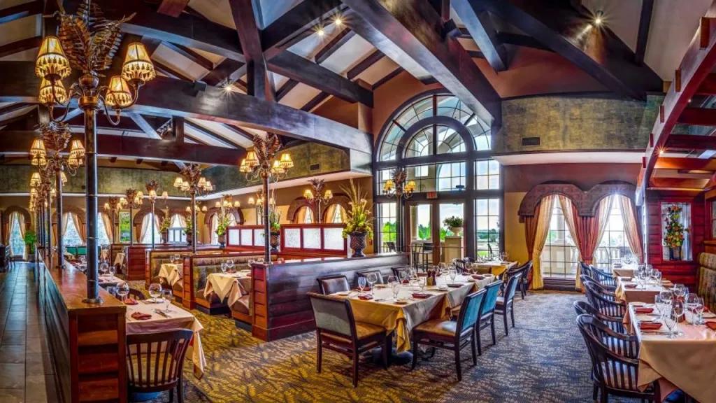 A Land Remembered The dining room of A Land Remembered with tables and booths surrounded by wooden decor