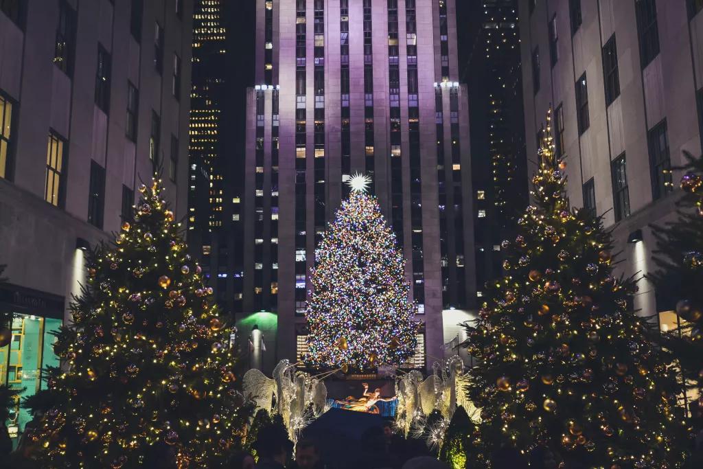 Rockefeller Center Christmas Tree A giant Christmas tree lit up in Rockefeller Center, in front of a skyscraper
