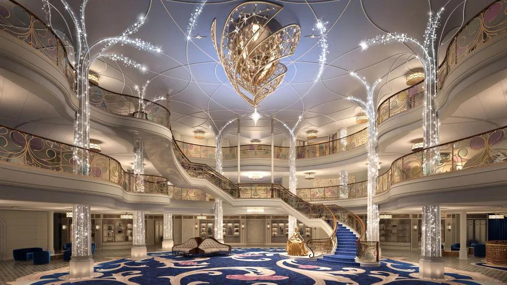 Disney Wish Entrance Hall Concept art of the entrance hall on the Disney Wish, with a large grand staircase in the centre and sparkling tree-like pillars at the sides