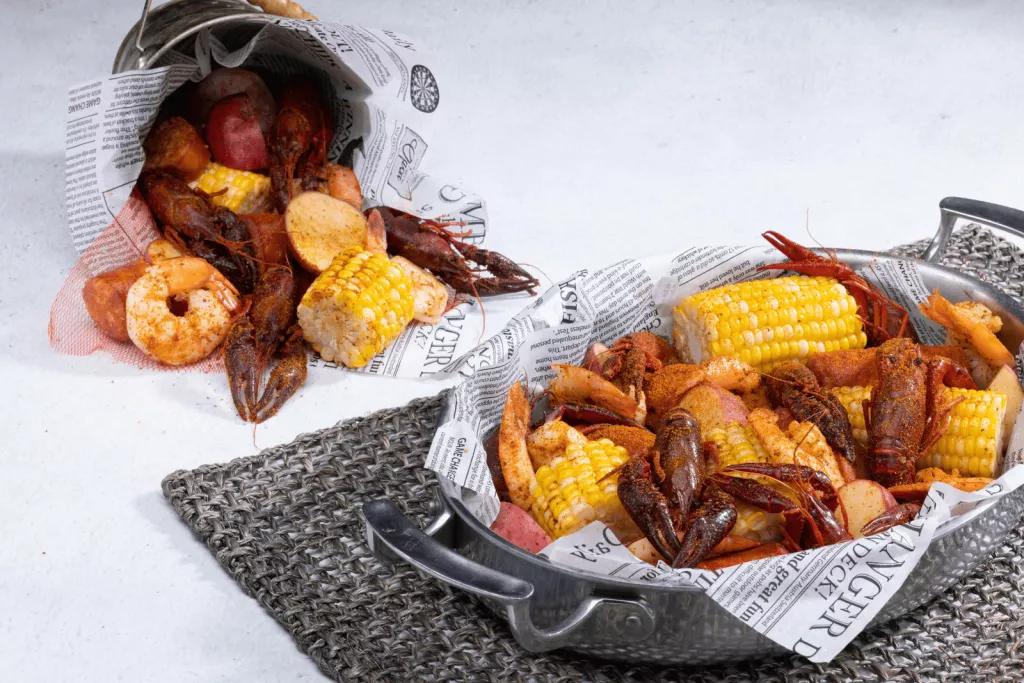 Crawfish Boil An overflowing pot of potatoes, corn, sausage and shrimp