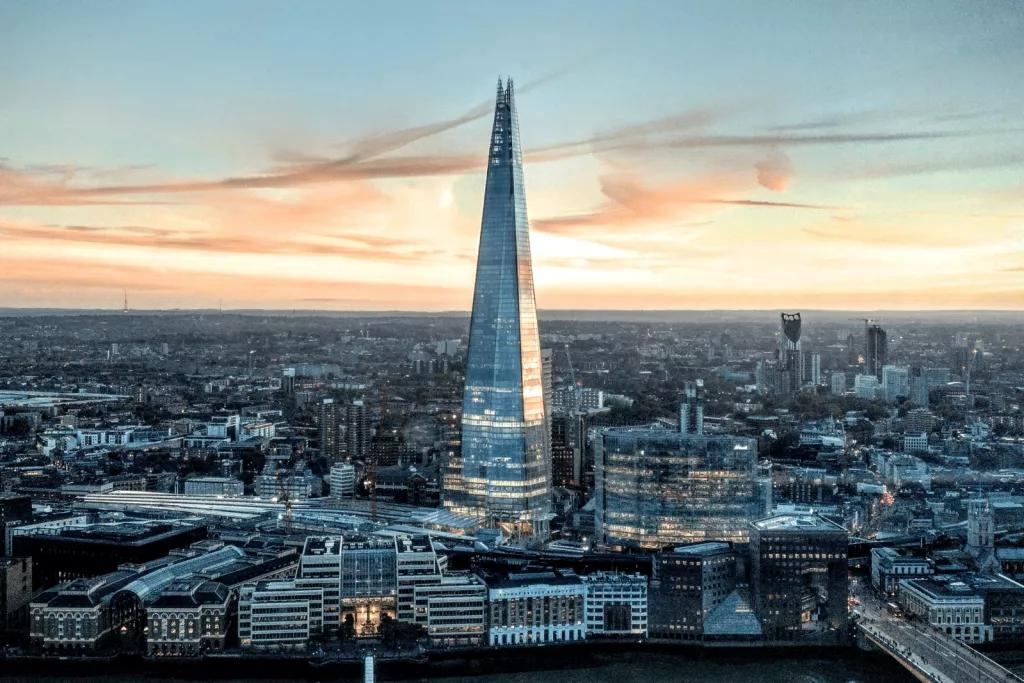 The View from The Shard The shard in front of a pink sky at sunrise