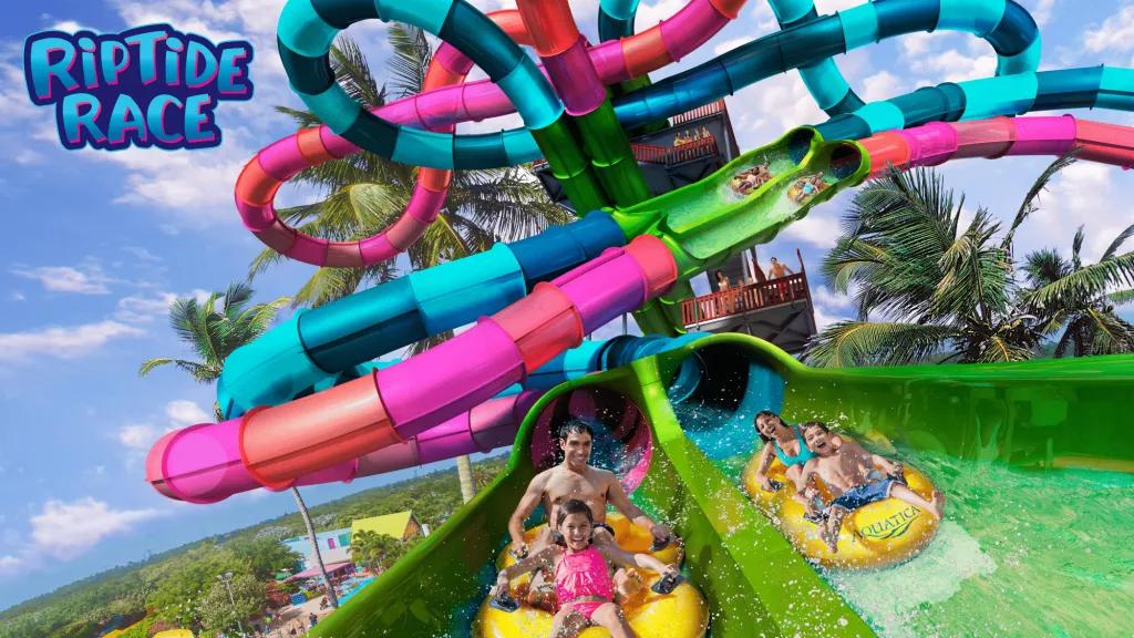 Riptide Race at Aquatica Concept art of Riptide Race with two two-seater rafts racing each other down parallel waterslides