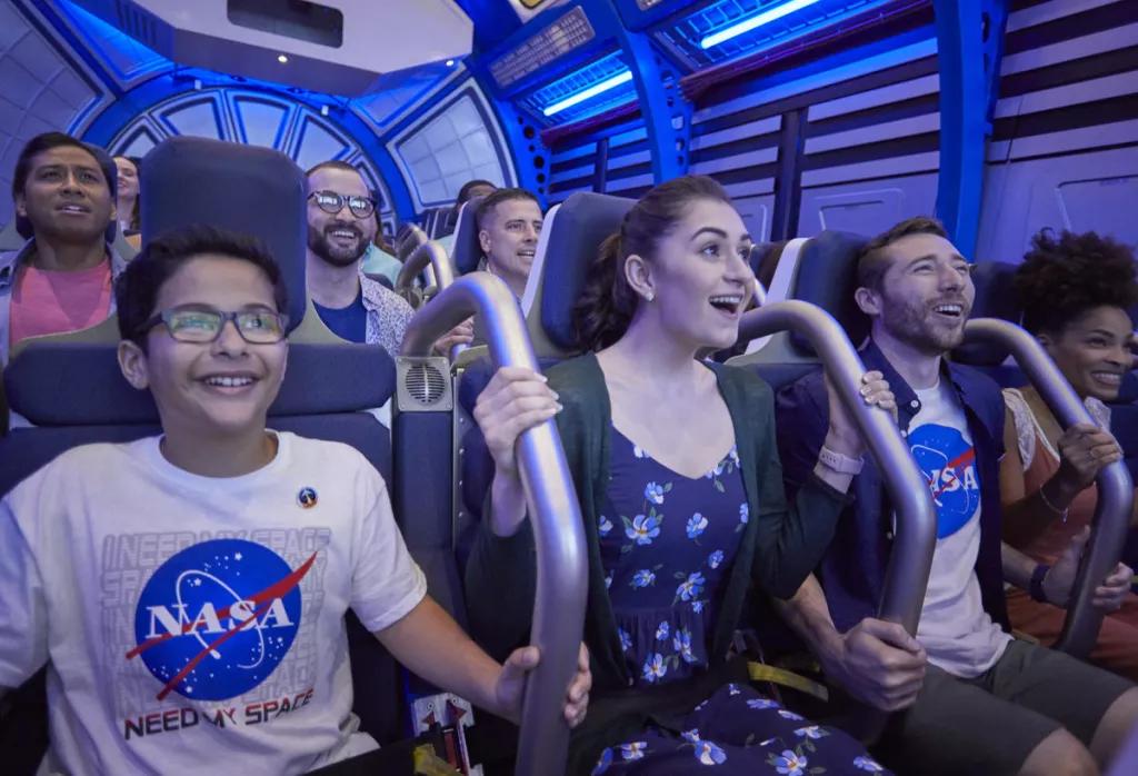 Shuttle Launch Experience at Kennedy Space Center Multiple guests smiling while on a simulator ride designed to look like the inside of a space shuttle