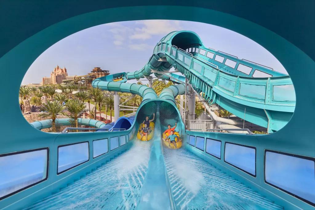 Medusa's Lair at Aquaventure Two duelling waterslides next to each other with people in rafts coming out the bottom of the tube