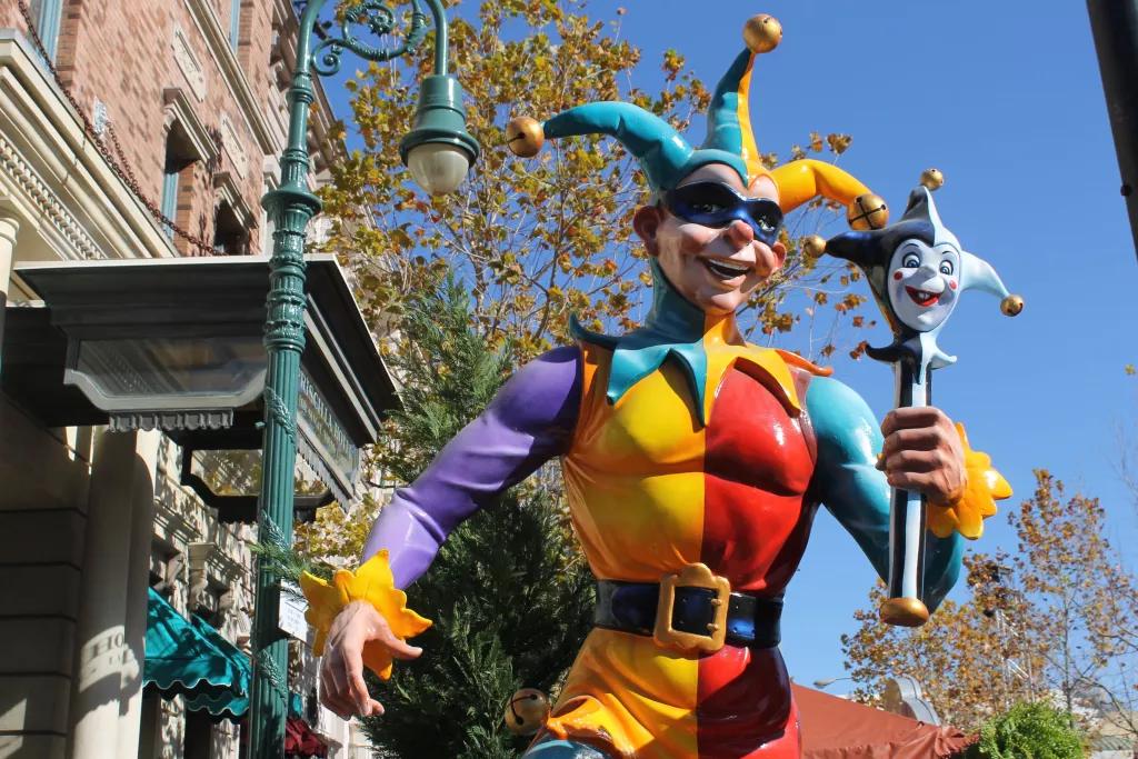 Mardi Gras Decorations A statue of a jester dressed in a bright multicoloured costume