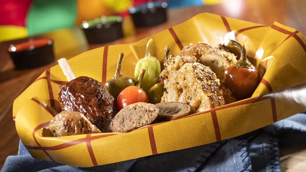 Plant-Based Food at Roundup Rodeo BBQ A basket of plant-based food including 'sausage', 'pork chop' and roasted cauliflower