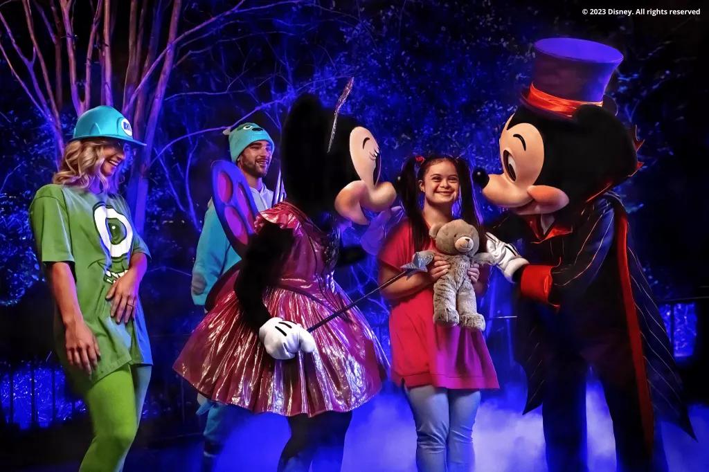 Character Meet and Greets Guests dressed as characters from Monsters Inc meeting Mickey and Minnie in their Halloween costumes