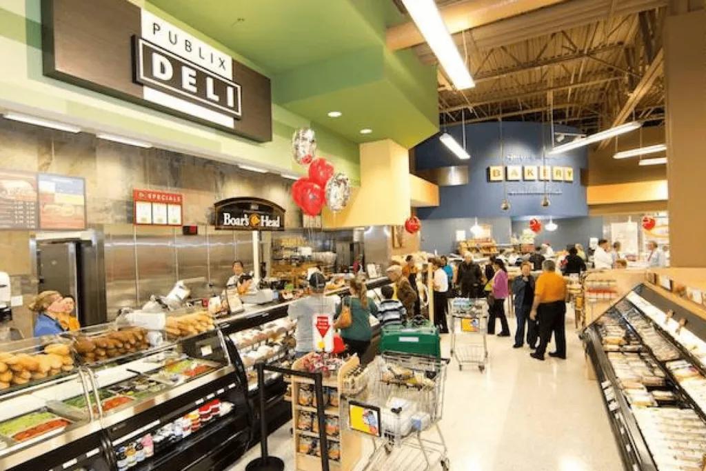 Publix Deli The inside of a grocery store with customers shopping at a deli counter