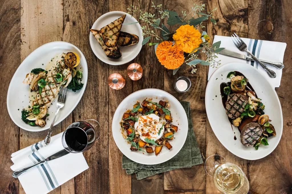 Dining Options in Orlando A bird's eye view of a table set with dishes of food, glasses of wine and table settings