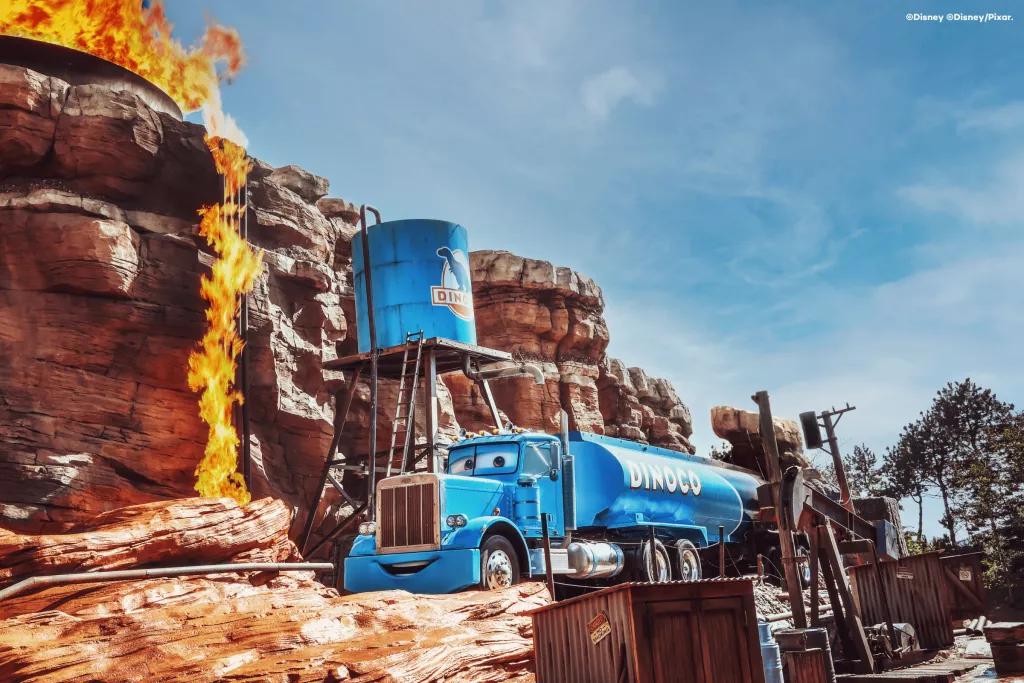 Cars ROAD TRIP at Disneyland Paris A cartoon style oil tanker in a canyon that is starting to light on fire