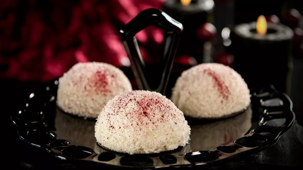 Bloody Snowballs A plate of chocolate cakes covered in desiccated coconut to look like snowballs