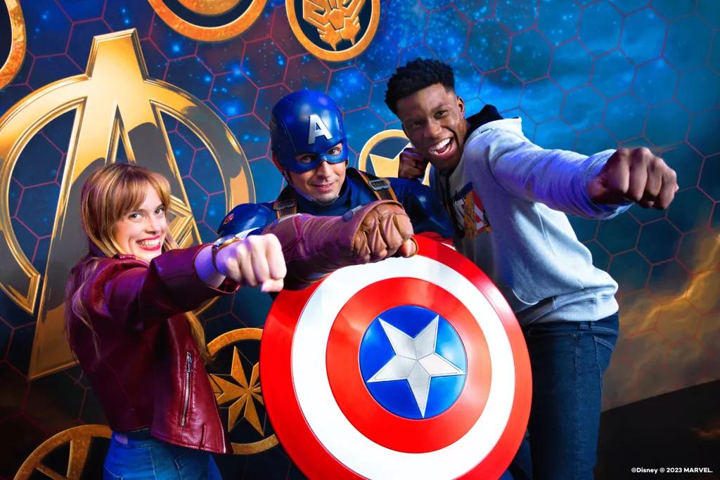 MARVEL Super Hero Station A man and a woman posing for a photo with Captain America