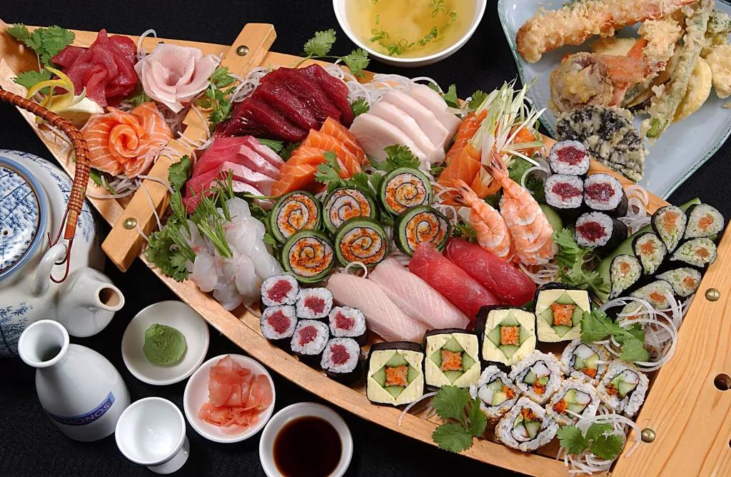 Sushi from Kimonos A wooden boat full of sushi
