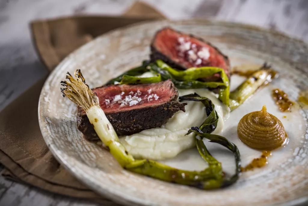 Filet from Toledo - Tapas, Steak & Seafood A plate of filet and spring greens