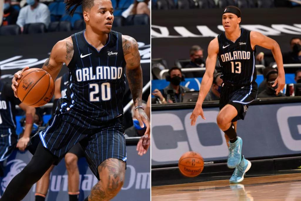 Orlando Magic Players Two men playing basketball wearing Orlando Magic jerseys