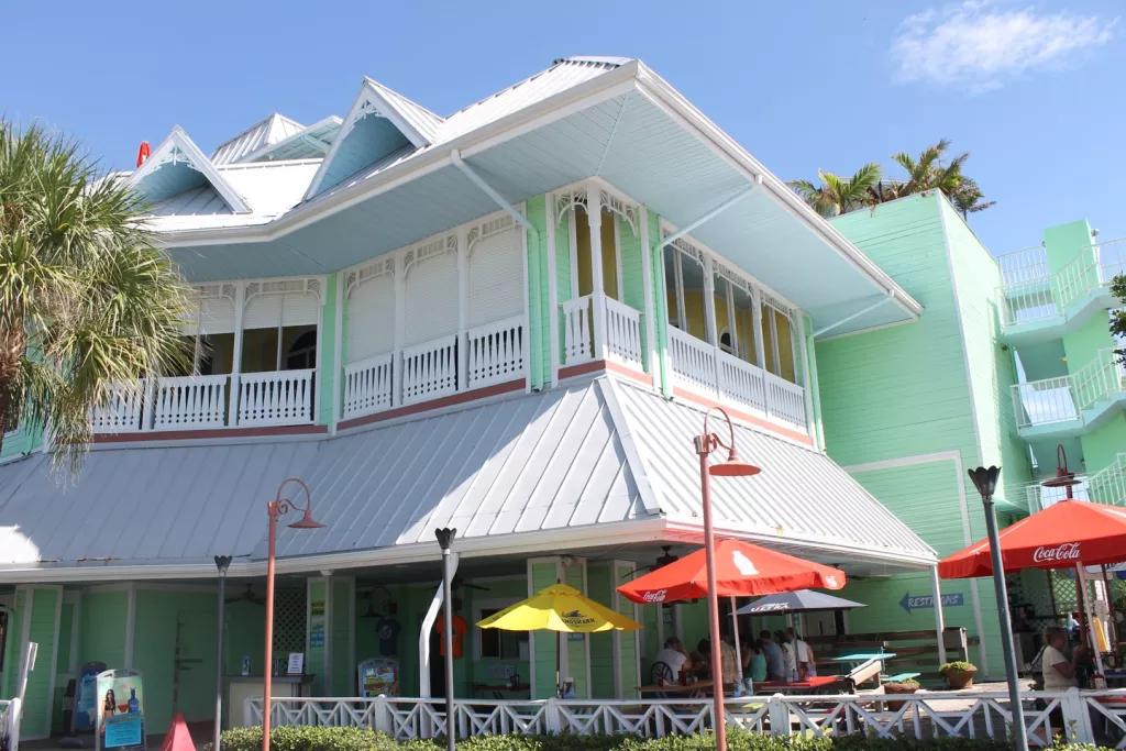 Hurricane Seafood Restaurant A beach hut style building with pale green cladding and a grey roof