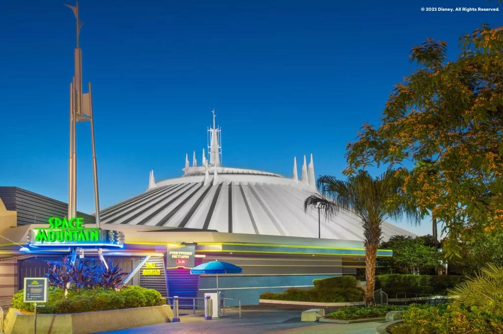 Space Mountain A futuristic white dome behind a neon sign reading Space Mountain