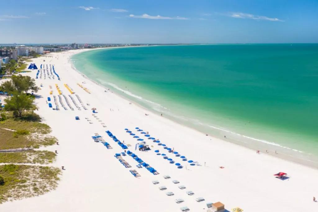 St Pete's Beach An aerial view along a white sandy beach lined with sun loungers