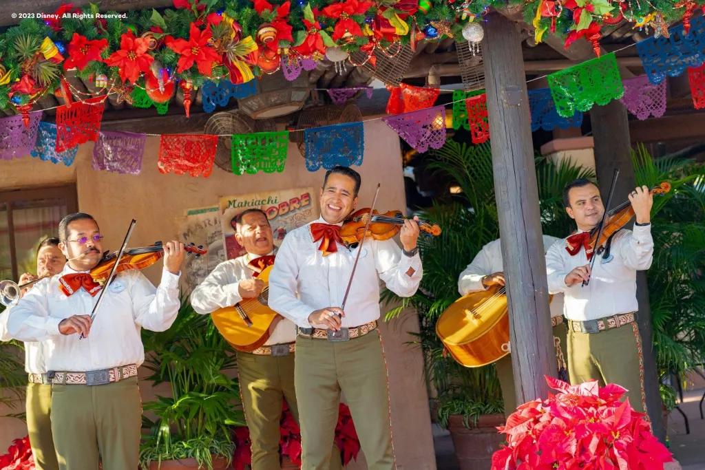 World Showcase Storytellers A band playing string instruments and wearing traditional Mexican outfits