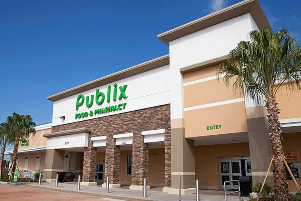 Publix The exterior of a Publix supermarket with palm trees in front and a blue sky behind