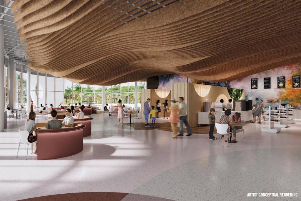 A quick-service dining room in a hotel with large windows and a curved wood ceiling