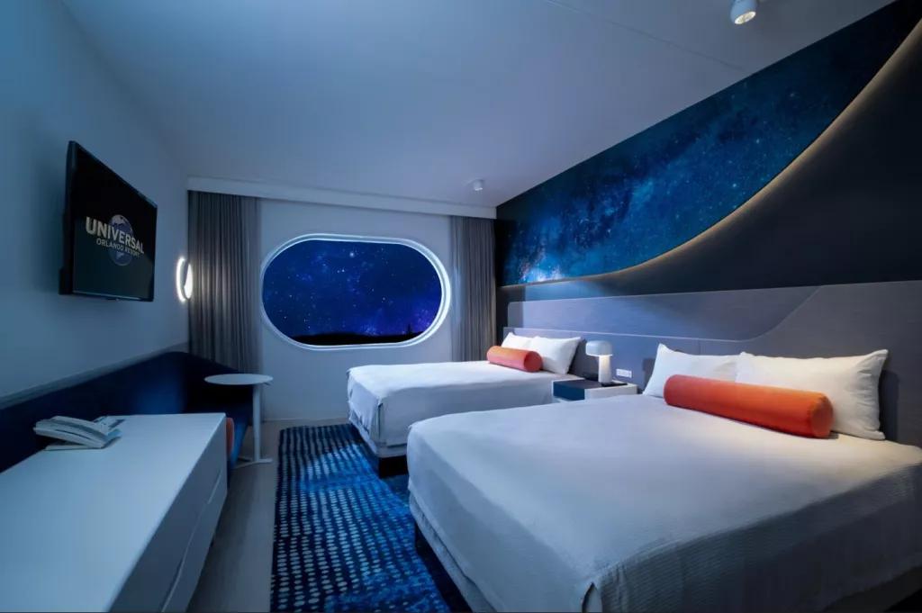 Concept art of a space themed hotel room with two beds, a desk and a TV