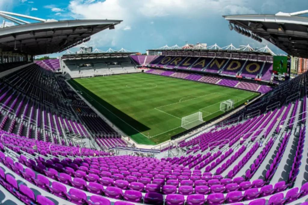 Orlando Inter & Co Stadium Looking down into an empty football stadium with purple seats. The pitch is empty