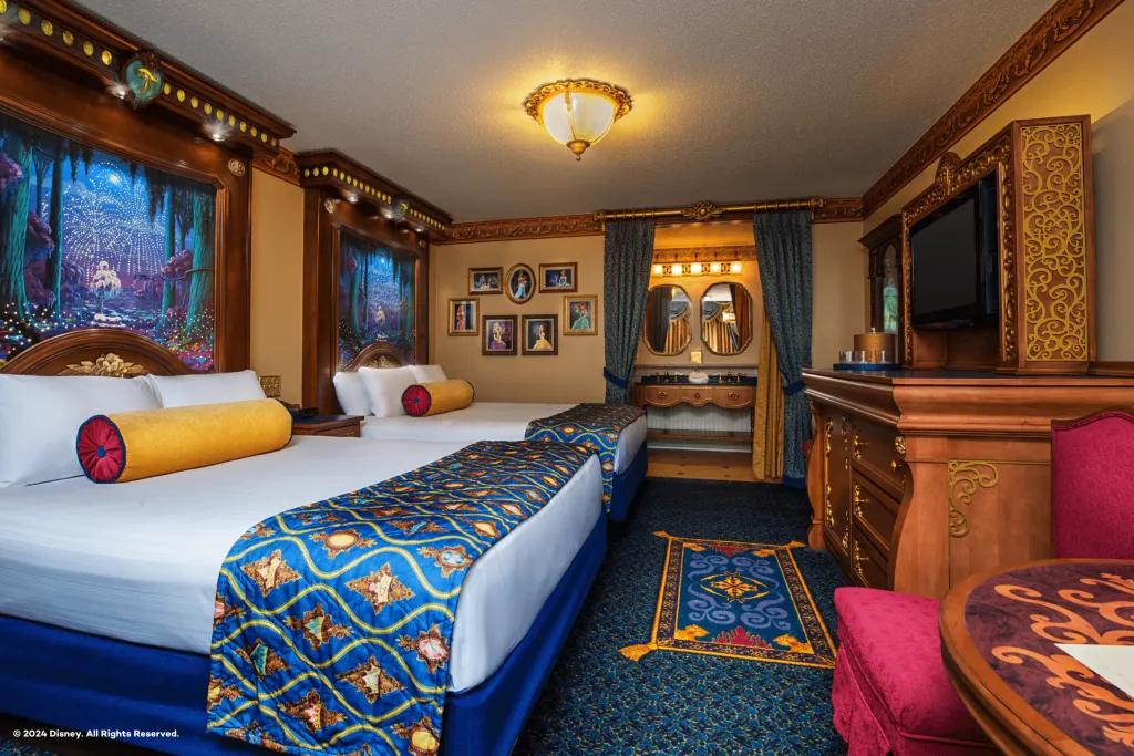 Royal Guest Rooms at Disney's Port Orleans Resort A hotel room with two beds decorated with Disney Princess touches