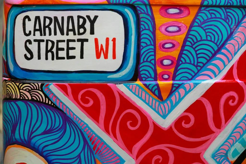 Carnaby Street Colourful wall art with the street sign for Carnaby Street in the corner