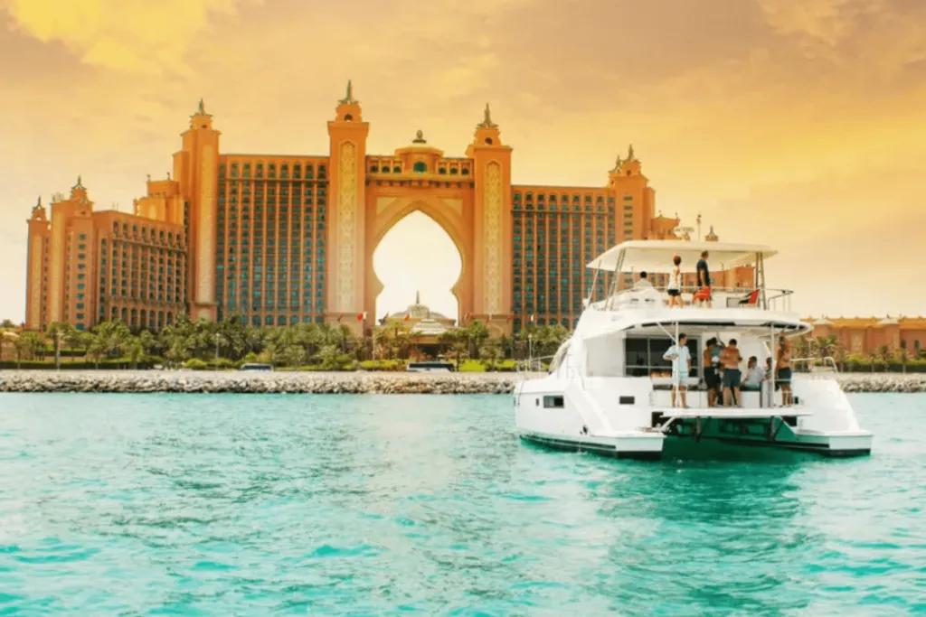 Luxury Dubai Yacht Cruise A large yacht sailing towards The Palm in Dubai