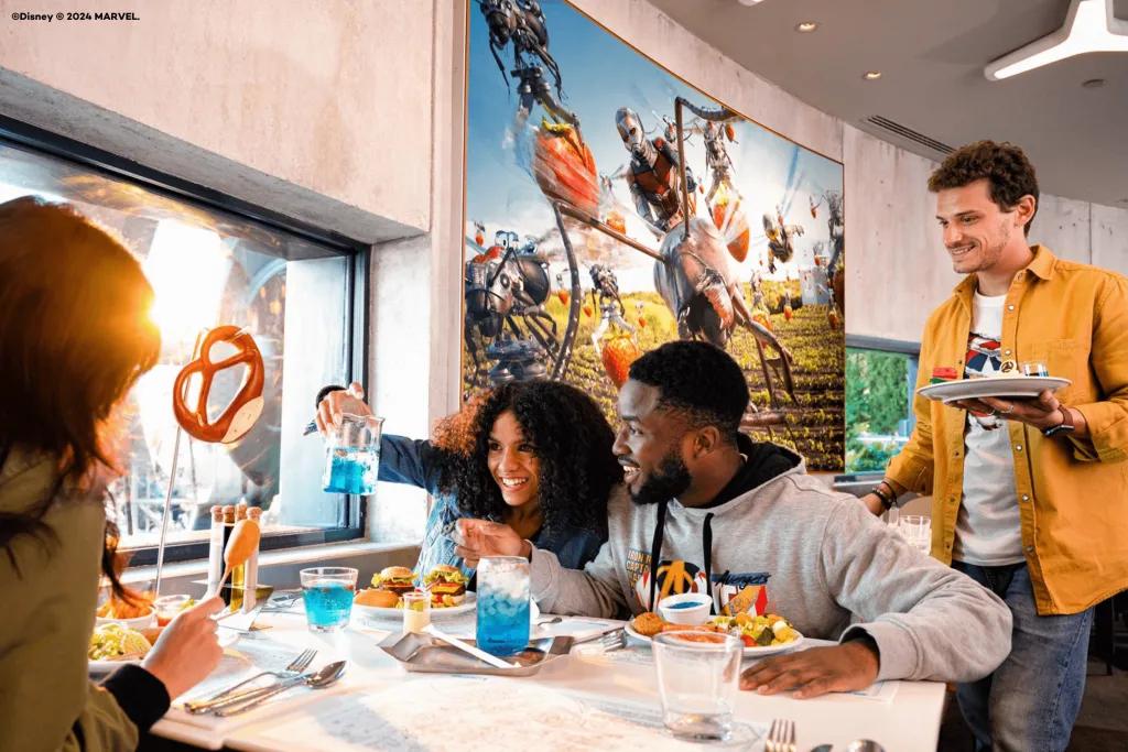 PYM Kitchen at Disneyland Paris A group of friends drinking cocktails designed to look like science equipment in PYM Kitchen