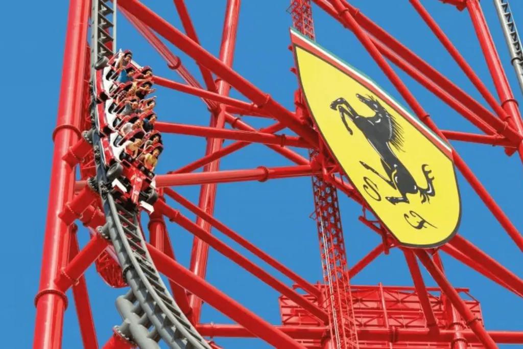 Ferrari Land Big tall rollercoaster which goes straight up and falls down steep drop. There is a huge Ferrari badge, a yellow shield with a black silhouette of a horse and the initials S and F. The rollercoaster car is shaped like a red Ferrari.