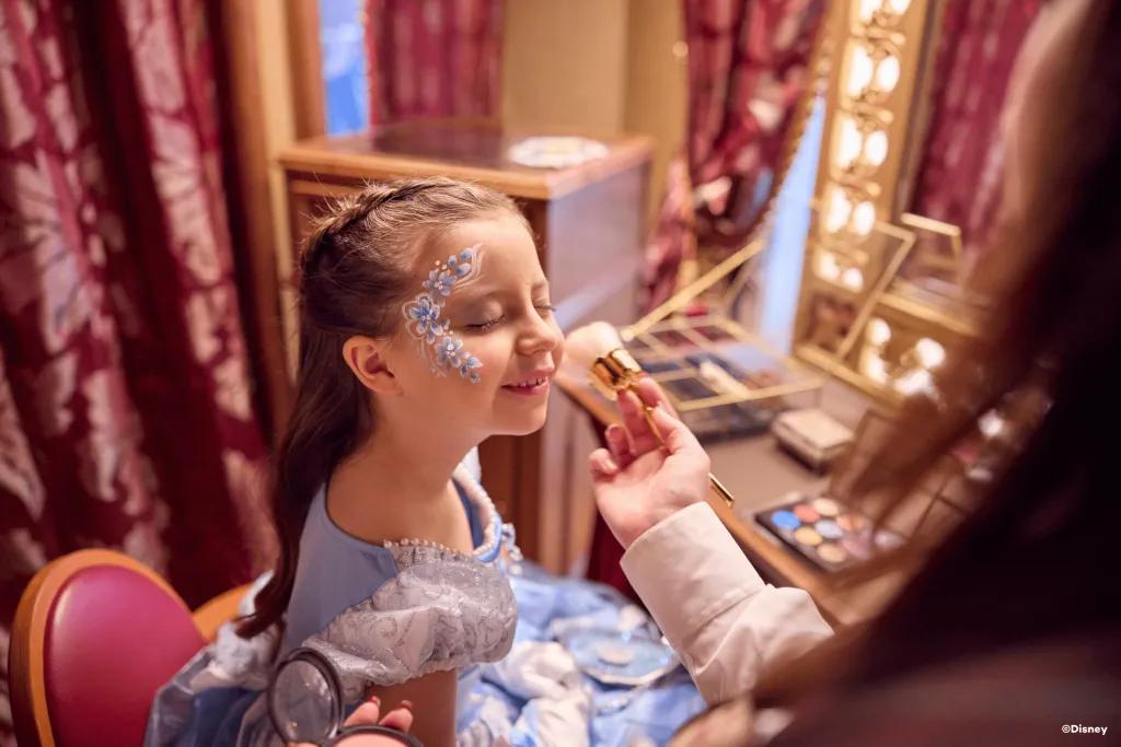 My Royal Dream A young girl dressed as Cinderella getting her face painted